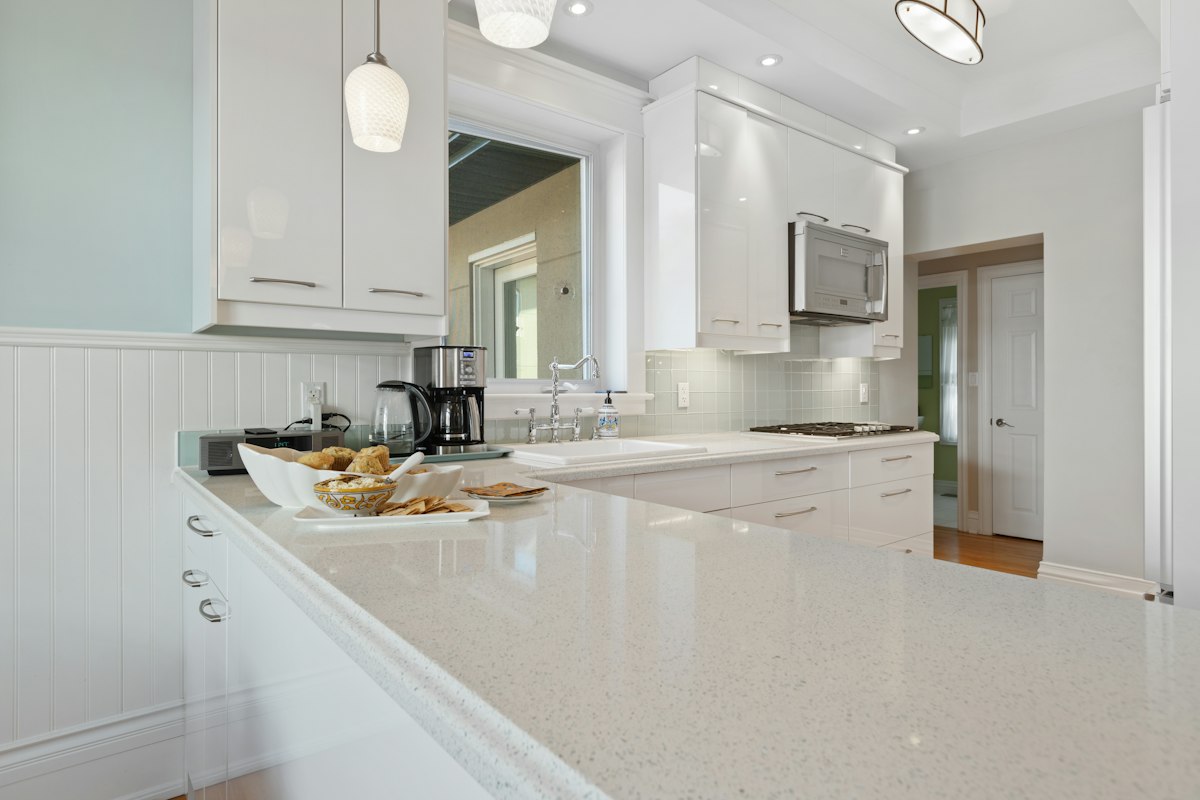 Kitchen with speckled stone countertops